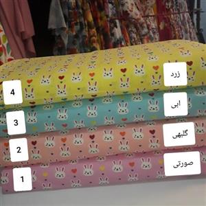 پارچه پپلین طرح عروسکی \nعرض 90 در چهار رنگ صورتی  - آبی  - گلبهی و رنگ زرد لیموی