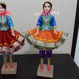یک عدد  عروسک دامن کوتاه نارنجی طرح سنتی محلی