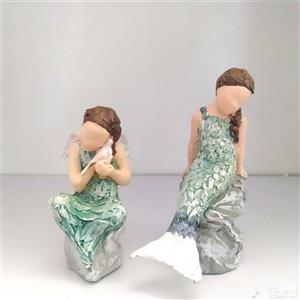 مجسمه آرورا پرنده به دست نشسته و آرورا پری دریایی