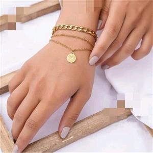 دستبند زنانه  ترکیب زنجیر کارتیر  و زنجیر ساده با آویز سکه جنس استیل (لاوین گالری)