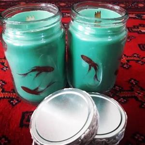 شمع دست ساز  شیشه ای معطر مدل ماهی گلی
