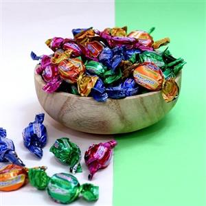 تافی کارولین میوه ای شونیز در طعم های متنوع بسته 450 گرمی روناس