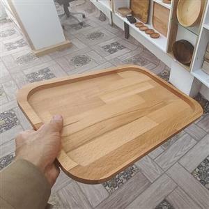 سینی  تمام چوب راش.کاملا ابگریز شده با روغن مخصوص.دستگیره رو به سفارش مشتری نصب میکنیم .