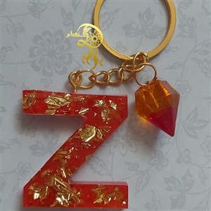 جاکلیدی رزینی حرفZ رنگ قرمز باورق طلا  واویزالماس یک عدد