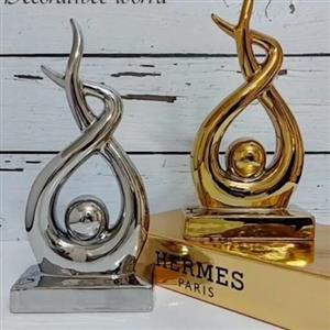 اکسسوری (دکوری ) تندیس فیگور،جنس سرامیک آبکاری شده،فورتیک و رنگ ثابت ،رنگ سیلور و طلایی