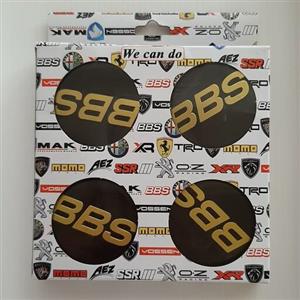 کاپ رینگ و آرم چرخ ماشین طرح BBS مشکی  نوشته طلایی مناسب تمام رینگهای اسپرت با سایز 030 ( پژو .پراید. ال نود و..)