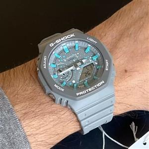 ساعت  مچی جی شاک GA2100 طوسی آبی های کپی(جیشاک GShock) تنظیم اتوماتیک با پایتخت کشورها ، اتولایت اتوماتیک