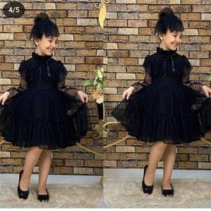 لباس مجلسی دخترانه دارای رنگ مشکی مخصوص محرمی مناسب 2 تا 12 سال جنس پارچه تور خال دار و آستری