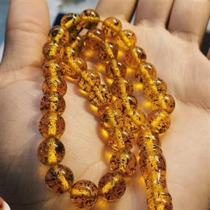 تسبیح کهربا معطر به بوی لیمو33 دانه  مدل دانه گرد حشره دار  متوسط کد2