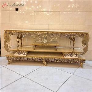 میز تلویزیون تمام برنجی با ام دی اف هایگلس، مدل فرشته بالدار و گل سرخ