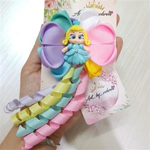 گلسر گیره مو پفکی آویز دار با پیکسل عروسکی در رنگبندی متنوع و دلخواه شما اکسسوری دخترانه