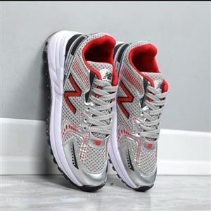 کتونی زنانه نیوبالانس تافی طوسی قرمز باتیس بوتیک