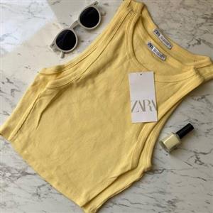کراپ تاپ زنانه  زارا  ،(واردات از بنگلادش)تک رنگ با کشسانی عالی جهت استفاده در باشگاه و زیرمانتو دارای سایز بندی