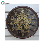 ساعت دیواری اویسا مدل 403، ساعت دیواری ساخته شده با بدنه پلاستیک، دارای چرخ دنده متحرک روی صفحه ساعت، اعداد لاتین، رنگ قهوه ای، سایز 68