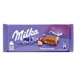 شکلات شیری میلکا milka با تکه های فندق و کشمش 100 گرمی