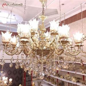 لوستر سایز بزرگ 16 شعله طرح گلناز با سر شاخه های کریستالی و بدنه ی برنزی رنگ ثابت کد 6010