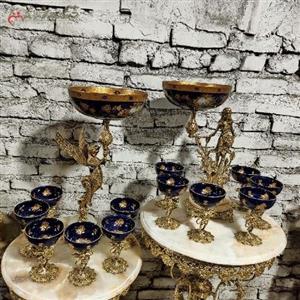 هفت سین برنجی با پیاله های سرمه ای طرح دار و پایه های طرح فرشته، ظریف کاری شده و پر کار