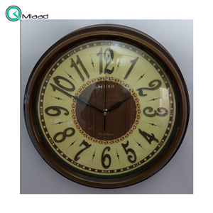 ساعت دیواری ولدر Welder مدل 125، ساعت دیواری سایز 36 با عقرب های متفاوت، صفحه کاغذ دیواری ترک، شماره برجسته مولتی، دارای موتور درجه یک میتسو، رنگ قهوه ای
