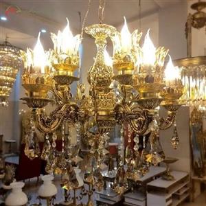 لوستر آلیاژ طلایی رنگ دارای 5 شاخه ی دوبل و سر شاخه های کریستالی، دارای ضمانت