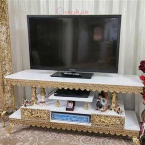 میز تلویزیون 2 طبقه 4 ستونه طول 120 جنس آلیاژ آلومنیوم با آبکاری برنز کد 0a-322