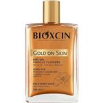 روغن مرطوب کننده و شاین صورت و بدن و مو بیوکسین Bioxin مدل Gold On Skin حجم 100 میل