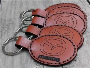 جا کلیدی چرم طبیعی دست دوزی شده با آرم مزدا کد 01