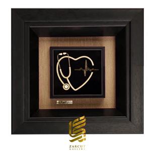 تابلو ورق روکش طلا طرح گوشی پزشکی