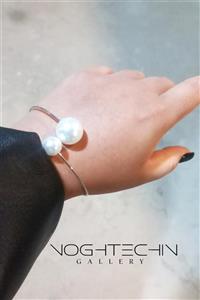 دستبند زنانه برند فشن مدل مرواریدی دفرمه استیل با کیفیت بالا