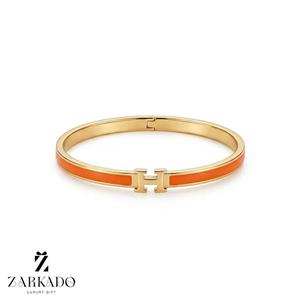 بنگل طلا طرح هرمس با میناکاری نارنجی 