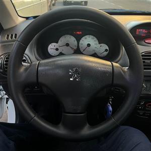 فرمان چرمدوزی شده فابریکی ۲۰۶ دست‌دوز، پرس‌شده و ارگونومیک